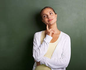 Image showing Woman, teacher thinking and chalkboard for education, learning information and teaching or knowledge. Young professor, lecturer or class educator with ideas, inspiration or goals for school vision