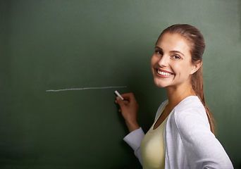 Image showing Woman, teacher portrait and drawing on chalkboard for education, learning information and teaching. Face of a young professor, lecturer or class educator writing a line on board for school knowledge