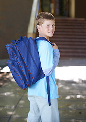 Image showing Portrait, boy and outdoor with backpack, education and school with knowledge, learning and student. Person, outside or kid with a bag, sunshine and cheerful with joy, excited or childhood development