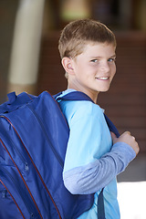 Image showing Portrait, boy and outdoor with backpack, knowledge and school with sunshine, learning and student. Person, outside or kid with a bag, education and cheerful with joy, excited or childhood development