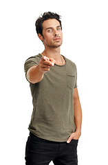 Image showing Serious, pointing and portrait of man in a studio for choice, vote or decision with confidence. Selection, fashion and handsome young male model with a show hand gesture isolated by white background.