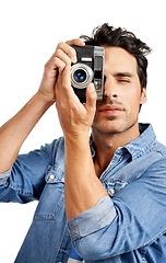 Image showing Portrait, camera and man with photography, creativity and paparazzi isolated on a white studio background. Face, person and model with vintage equipment, photographer and photoshoot with journalist