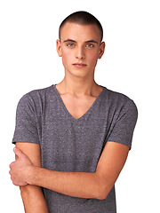 Image showing Portrait, fashion and a confident young man in studio isolated on a white background for casual style. Model, tshirt and serious person looking trendy in a relaxed clothing outfit for a personality