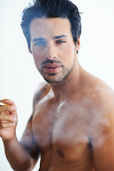 Image showing Handsome man, portrait and smoking cigarette in addiction, drag or tobacco against a white studio background. Face of attractive male person, model or shirtless addict smoker in stress relief smoke