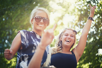 Image showing Portrait, outdoor and women with celebration, dancing and nature with happiness, smile and cheerful. Face, people and friends with music festival, concert and energy with culture, environment and joy