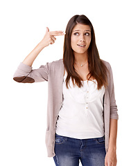 Image showing Face, stress and woman with hand gun in studio with self harm, gesture or overthinking on white background. Finger, weapon and model with mistake, disaster or conflict awareness for mental health