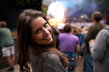 Image showing Excited woman, portrait and face at outdoor music festival for party, event or DJ concert in nature. Closeup of female person smile in crowd at night for carnival, performance or summer fest outside