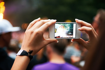 Image showing Person, hands and music festival or cellphone picture or entertainment stage, party concert or crowd audience. Woman, fingers and mobile device at performance event, photography or dj celebration