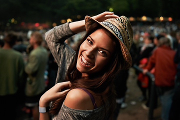 Image showing Happy woman, portrait and night at music festival party, event or outdoor DJ concert. Face of female person smile with hat in evening crowd or audience at carnival, performance or summer fest outside