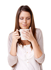 Image showing Coffee, relax and morning with a young woman in studio isolated on a white background for caffeine. Happy, calm and quiet with a confident person drinking tea from a mug or cup to start her day