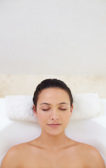 Image showing Bath, face and woman relax in a bathtub for wellness, stress relief or body care with comfort at home. Self care, peace or person bathing in tub for cleaning, pamper or diy spa bathroom treatment