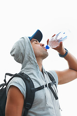 Image showing Person, hiking and drinking water in nature rest for fitness, exercise and workout in Brazil mockup space. Hiker, athlete and man with liquid bottle for summer sports break, electrolytes and wellness