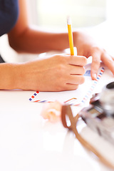 Image showing Hands, pencil and writing on letter on table, thought and communication for envelope in apartment. Young person, paper message and mail with idea, thinking and courier to post vintage note in home