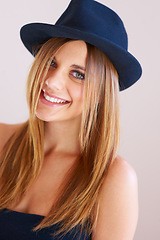 Image showing Hipster, hat and portrait of happy woman with vintage, fashion and confidence in white background or studio. Retro, style and face of person in old fashioned fedora with makeup, cosmetics and beauty