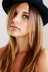 Image showing Hipster, hat and portrait of woman with vintage, fashion and confidence in white background or studio. Retro, style and face of person in old fashioned fedora with makeup, cosmetics and beauty