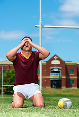 Image showing Upset, sad and rugby player on a field for competition loss for training and match. Fit, athlete and sports with man and ball for mistake or fail in competitive looking frustrated in a uniform