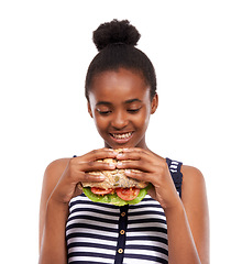 Image showing Sandwich, delicious and woman eating fast food and happy with lunch meal isolated on a white studio background. Breakfast, craving and smile with African person enjoy snack, mockup space and burger