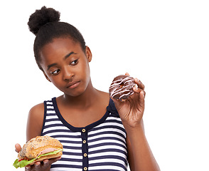 Image showing Black girl, decision and donut with sandwich, choice and nutrition isolated on a white studio background. African person, mockup space and model with sweet snack, burger and comparison with wellness