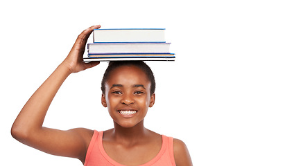 Image showing Portrait, smile and black girl with books on her head, education and balance isolated on a white studio background. Face, African person and model with mockup space and learning with knowledge