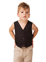 Image showing Studio portrait, fashion and casual child in trendy clothes, apparel or fashionable outfit, attire or style. Young boy, stylish and youth kid in chino pants, vest and isolated on white background