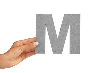 Image showing Hands, font and capital letter M in studio isolated on a white background mockup space. Fingers, alphabet or closeup of sign for typography, communication or learning language, character or show icon