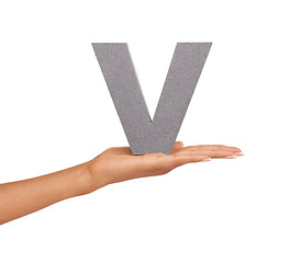 Image showing V, alphabet and hand with letter on a white background for spelling, language and message. English, communication and isolated sign, symbol and icon on palm in studio for learning, education and font