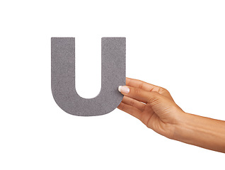 Image showing Hands, alphabet and capital letter U in studio isolated on a white background. Fingers, font and closeup of sign for typography, communication or learning language, character or show uppercase icon