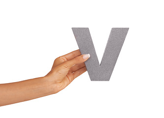 Image showing Hands, font and capital letter V in studio isolated on a white background mockup space. Fingers, alphabet and closeup of sign for typo, communication or learning language, character or uppercase icon