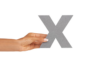 Image showing Hands, font and capital letter X in studio isolated on a white background mockup. Fingers, alphabet and closeup of sign for typo, communication or learning language, character or show uppercase icon
