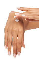 Image showing Hands, woman and skincare cream for manicure, beauty and aesthetic cosmetics in studio on white background. Closeup, dermatology and apply lotion, moisturizer and soft treatment of nails on fingers