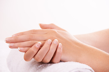 Image showing Woman, hands and french manicure in salon, spa and cosmetic care, skincare and beauty. Natural growth, wellness and treatment for hygiene, closeup and nail parlour with towel, clean and maintenance