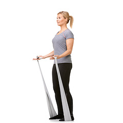 Image showing Sports, resistance band and woman doing exercise in studio for health, wellness and bodycare. Fitness, full length and young female person from Canada with arm workout or training by white background