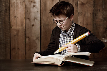 Image showing Education, book and young child writing information, youth development study or problem solving homework solution. stationery, textbook and scholarship kid, boy or student thinking of academic answer