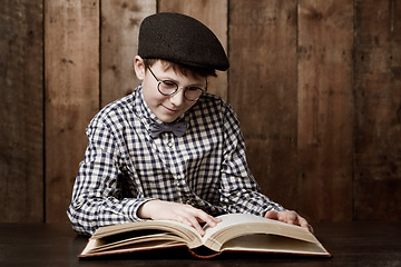 Image showing Learning, book and young child reading information, youth development or literature story for school homework. Literacy knowledge, education and kid student analysis, research or studying textbook