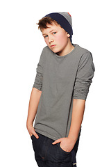 Image showing Teenager boy, fashion and studio portrait with hands in jeans pockets, trendy style and beanie by white background. Person, kid or child model with edgy clothes, cool streetwear or confidence on face