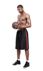 Image showing Fitness, sport and shirtless black man with basketball, six pack and body for muscle workout challenge. Wellness, health and professional athlete thinking with ball isolated on white background.