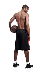 Image showing Man, basketball player and standing for workout, back and shirtless on white background, confident and game. Studio backdrop, fit and sportsman for exercise, health and african active athlete