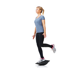 Image showing Balance board, fitness and woman with training, exercise and wellness isolated on white studio background. Person, mockup space and model with equipment, workout and progress with challenge or health