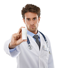 Image showing Doctor, serious and portrait in studio with tablet, prescription medication and healthcare with pharmaceuticals. Pharmacist, face and advice for medicine support, pills and drugs by white background
