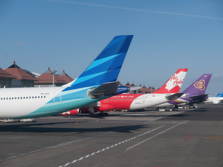 Image showing Tailplanes of Airbus and Boeing airplanes in Bali