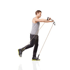 Image showing Exercise, workout and resistance band with a young man in studio isolated on a white background for health. Gym, fitness or performance and a strong athlete training with equipment for wellness