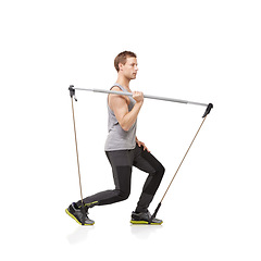 Image showing Exercise, thinking and resistance band with a young man in studio isolated on a white background for health. Idea, fitness or performance and a strong athlete training with equipment for wellness