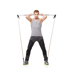 Image showing Portrait, exercise, workout and resistance band with a young man in studio isolated on white background for health. Fitness, gym or performance and strong athlete training with equipment for wellness