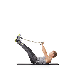 Image showing Exercise, man and resistance band with fitness, healthy and wellness isolated on white studio background. Mockup space, person and model with workout, training and progress with energy and endurance