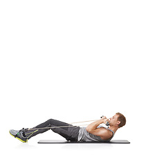 Image showing Exercise, man and resistance band with fitness, energy or wellness isolated on white studio background. Mockup space, person or model with workout, health or progress with cardio, crunch or endurance