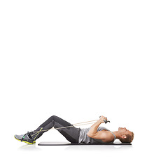 Image showing Exercise, man and resistance band with fitness, workout or wellness isolated on white studio background. Mockup space, person or model with core training, healthy or progress with energy or endurance