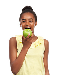 Image showing Eating, smile with portrait of girl and apple in studio for nutrition, wellness and diet. Food, self care and vitamin c with face of African student and fruit on white background for fiber and health