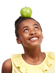 Image showing Balance, smile and health with girl and apple in studio for nutrition, wellness and diet. Food, self care and vitamin c with face of African teenage child and fruit on white background for choice