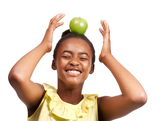 Image showing Balance, health and laugh with girl and apple in studio for nutrition, wellness and diet. Food, self care and vitamin c with face of African student and fruit on white background for fiber and smile