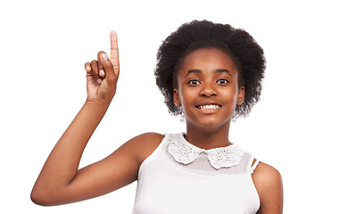 Image showing Smile, pointing and portrait of black girl in studio with mockup space for marketing or advertising. Happy, sale and young African child with positive face expression isolated by white background.